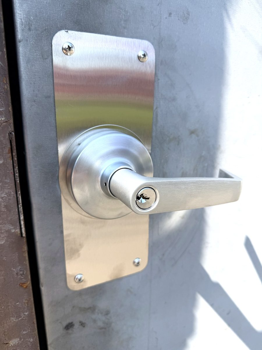 Exterior lever trim on a hollow metal door
