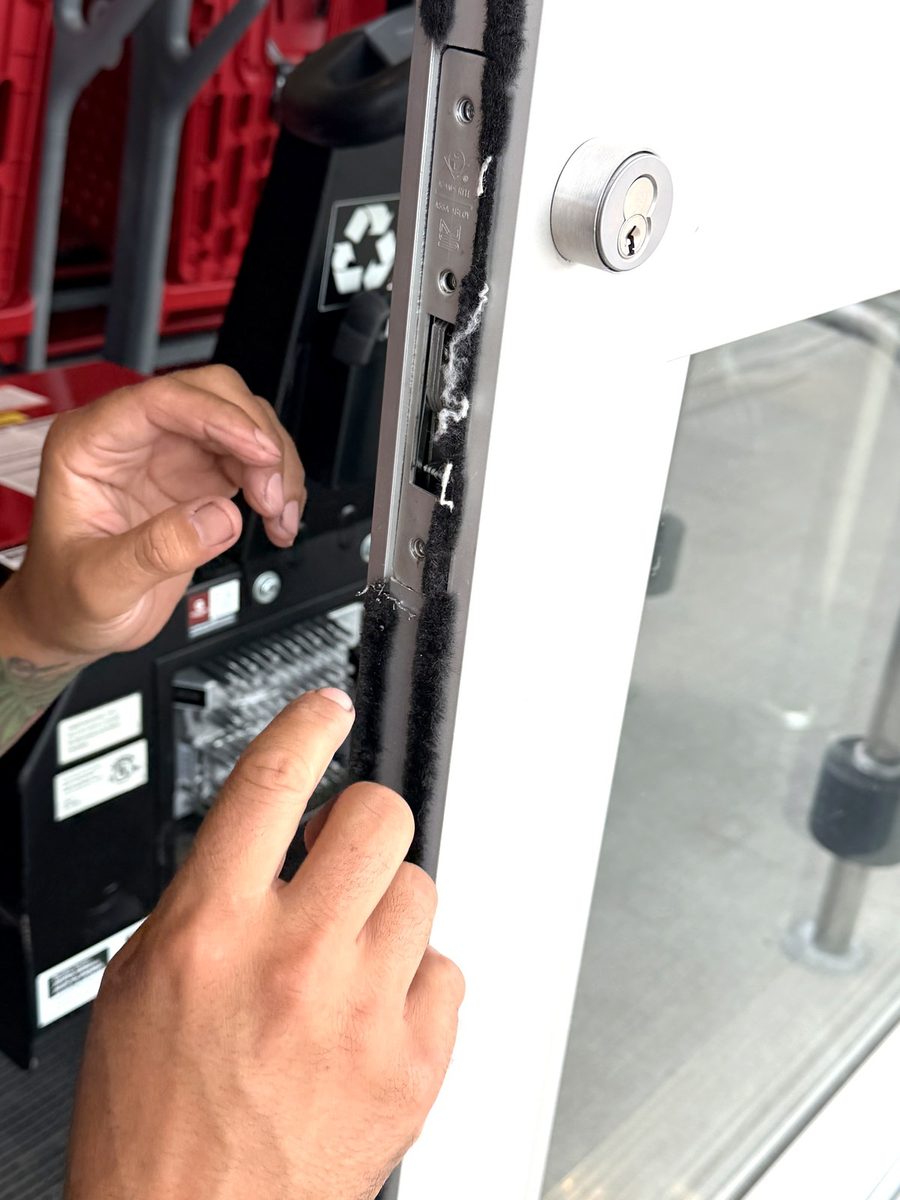 Working inside an aluminium storefront door