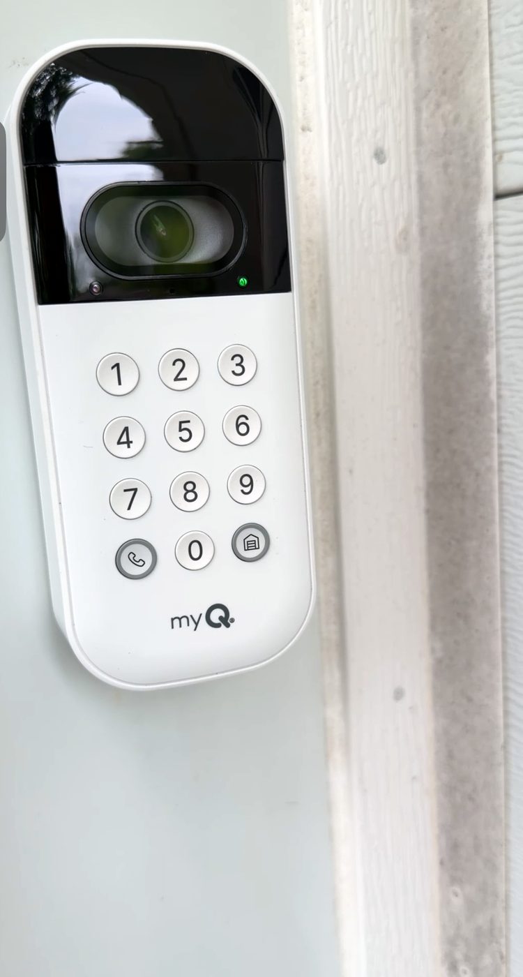 The myQ video keypad fitted beside a garage door