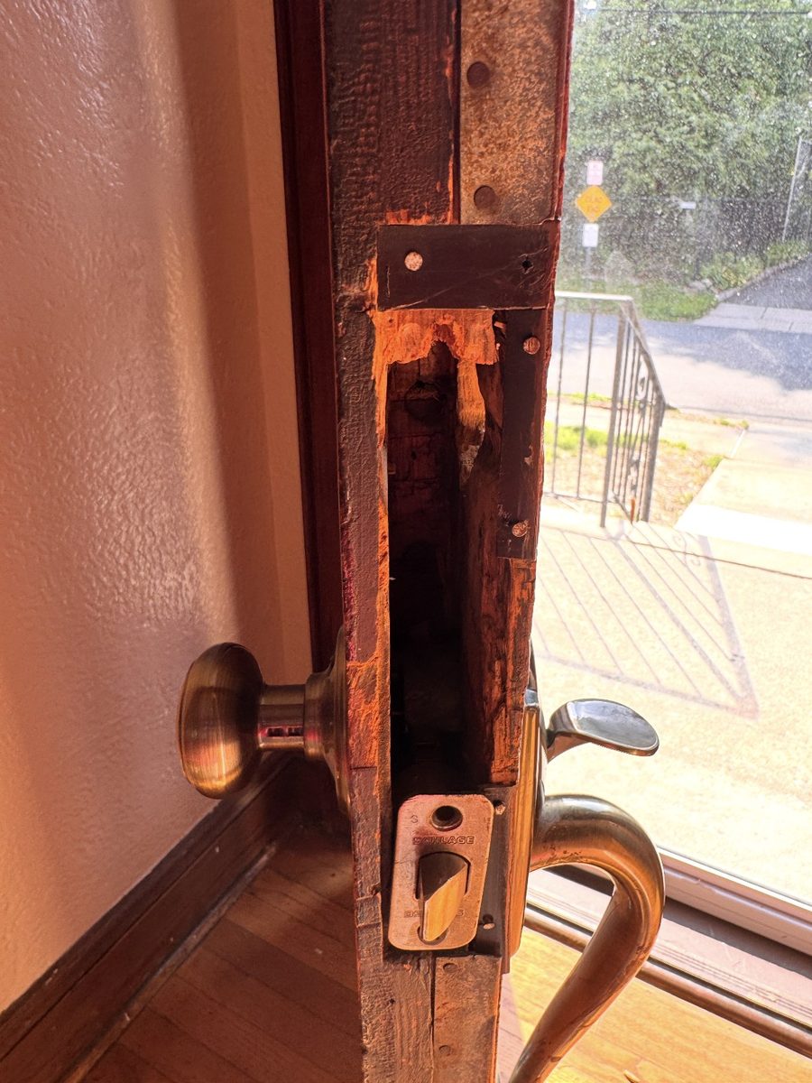 The mortise pocket in the edge of a hundred-year-old door, lockset removed