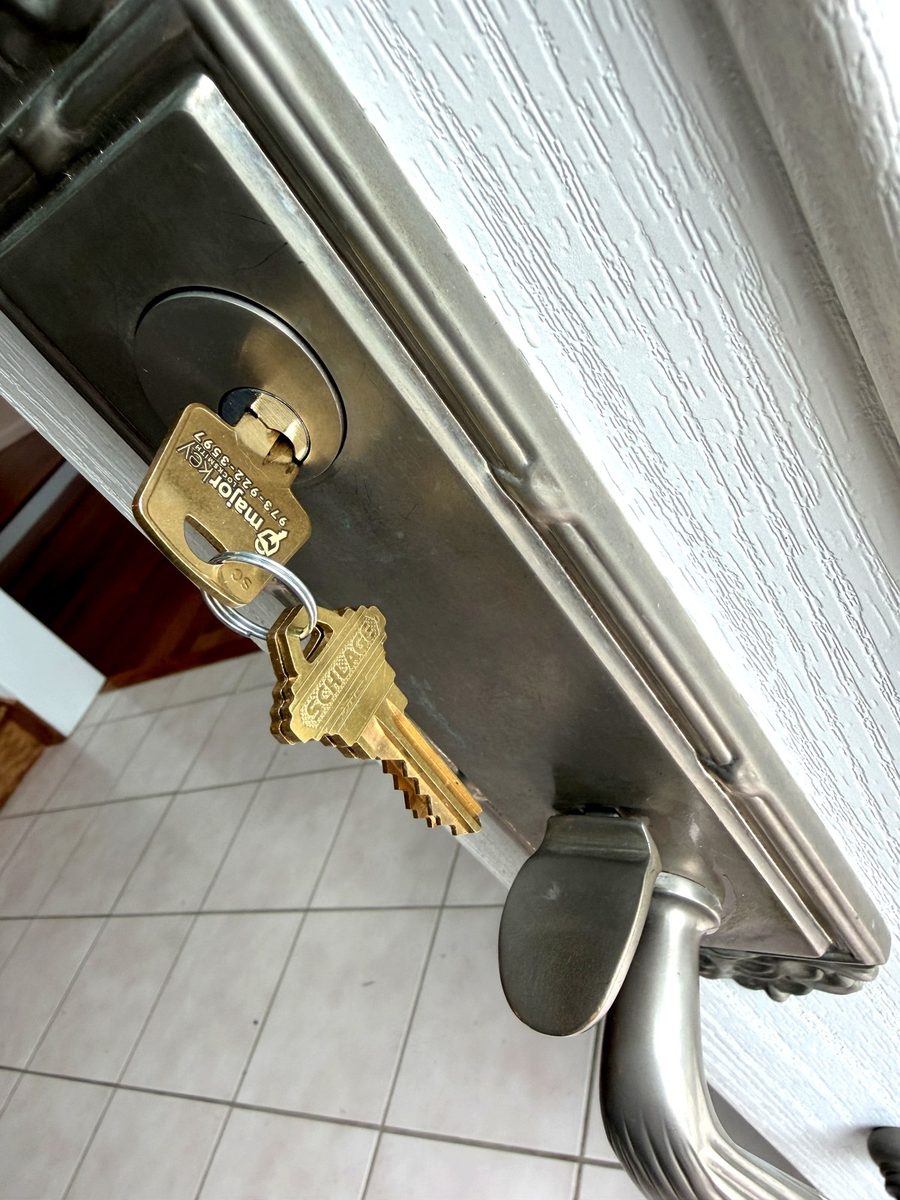 A freshly cut key tested in the lock before we leave